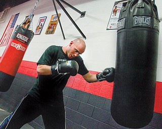 Kelly Pavlik works out at the South Side Boxing gym. Pavlik is starting preparations to fight Sergio Martinez on April 17.