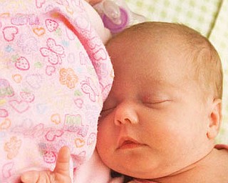 The Vindicator/Lisa-Ann Ishihara--- L-R Twins Elizabeth Lynn and Makeylah Rae, McCaskey lay in their crib at their parents, Kristin and Shane, residence.