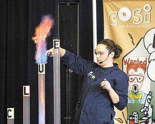 All eyes are on Allison Ballantyne, of the Center of Science and Industry, as she takes the students of Lloyd Elementary in Austintown through an investigation — using heat and tubes — to find ingredients for making slime. COSI visited the school Wednesday to give students hands-on experience working with chemistry projects.
