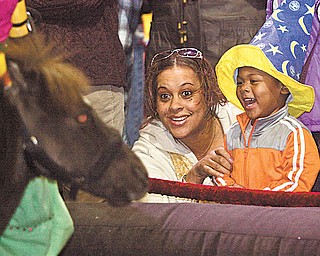 Dominique Moore and 3-year-old Stevie Dean are equally excited by a pony at the Covelli Centre. The animal was part of the entertainment before the circus. Bros. and Barnum & Bailey’s “Zing Zang Zoom” Circus at the Covelli Centre on Thursday night. The circus continues there through Sunday night.