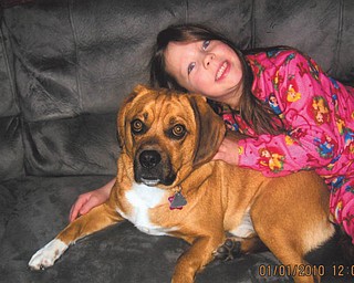 Carli Osiniak, 5 1/2, daughter of Ron ad Lisa Osiniak of Campbell, is relaxing with her best friend, Brutus.