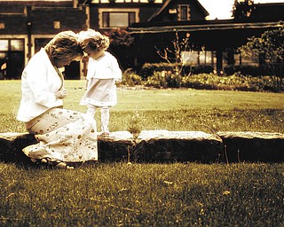 Laurie and Hannah LaPlante share a moment together while preparing for a MotherÕs Day family portrait. Taken by John LaPlante, husband and dad..