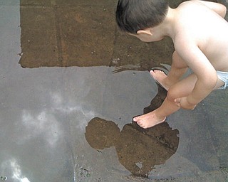 Max Caguiat, 2, of Boardman, could be singing ÒMe and My ShadowÓ during this visit to Mill Creek ParkÕs Wick Recreation Area in Youngstown..