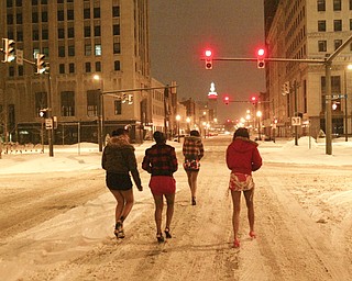 Headed towards a downtown nightspot on Central Square are, from left, Ebony Franklin, Deedee Dunne, Charmaine Payne and Asia Howell, all of Youngstown.