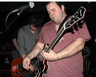 Lead guitarist Jay Hinrichs, right, and singer Robbie Jay McFarland, both of the Hubbard-based Robbie Jay Band, got the crowd moving at Cedars on Saturday, Feb. 27, 2010.
