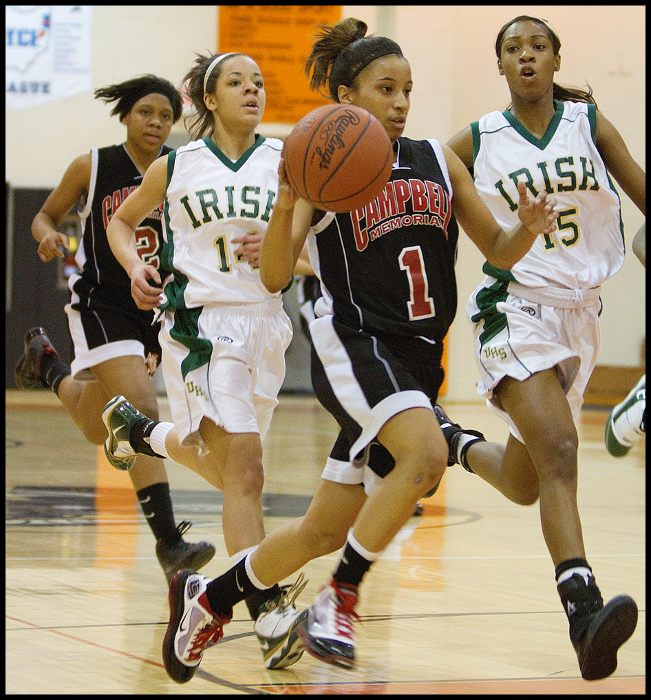 Geoffrey Hauschild|The Vindicator.Campbell's Tashira Uceta (1) heads for the hoop followed by teamate, Iesha Moses (2) at the end of the pack and Ursuline's Ja'Nice Whitehead (14) and Dominique Jenkins (15) during the fourth quarter at Mineral Ridge High School on Saturday afternoon.
