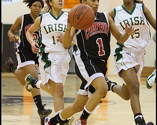 Geoffrey Hauschild|The Vindicator.Campbell's Tashira Uceta (1) heads for the hoop followed by teamate, Iesha Moses (2) at the end of the pack and Ursuline's Ja'Nice Whitehead (14) and Dominique Jenkins (15) during the fourth quarter at Mineral Ridge High School on Saturday afternoon.