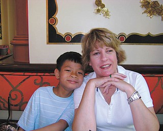 Christion Bi is Mary ComptonÕs adopted son from Vietnam. They live in Poland..