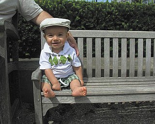 Jack Hurdley of New Middletown is enjoying the sun on vacation on his own ÒminiÓ park bench. Sent by his mother, Jessica Hurdley..