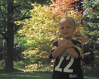 Ryan Joseph Maggie Jr. is posing buy a beautiful Japaneese maple tree in his backyard. Sent by MacKenzie Maggie of New Castle, Pa..