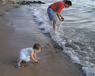 Jonathan Caguiat of Boardman with Max Caguiat, 1, are photographed in Charlevoix, Mich., in August 2008 by Tani Spielberg of Boardman..