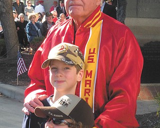 Jackie LeViseur sent this picture of her nephews, Brady and Casey Leugers of Canfield, and her dad, Ed LeViseur, at the reading of the names on Veterans Day in downtown Youngstown..