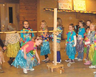 Judi Hickok of Canfield send this picture of Maddie MoranÕs birthday luau Ñ doing the limbo..