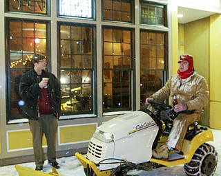 Richard Mills was out plowing sidewalks on Federal Street Friday, Feb. 26, 2010. Here, he's talking with Lemon Grove owner Jacob Harver.