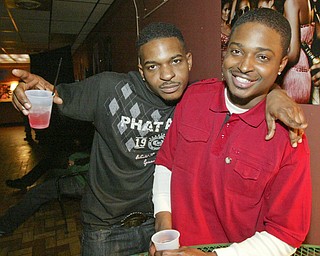 Cory North, left, known as City Jones, entertains at Love Lounge in downtown Youngstown. At right is Love Lounge general manager Cory Fruster, also known as "Corporate".