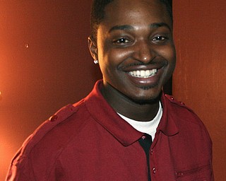 Corey Fruster; manager of the Love Lounge located on West Federal Street; is all smiles when it comes to the idea of revitalizing downtown. Fruster said the nightclub offers urban chic to its patrons.