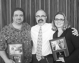 Special to The Vindicator
Two employees of Iron and String Life Enhancement were recognized for their unstinting work with adults and children with disabilities during an annual Employee of the Year luncheon in January. Jimmy Sutman, president of ISLE, center, congratulates the honorees, Mike Lucas and Kelly Buhro as they display their service awards.