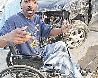 Willie Daniel of Youngstown, who is paralyzed from the waist down, explains what happened when his brother was driving the SUV in the background with him as a passenger. He said they were in an accident and a responding officer dragged him from the truck and roughed him up.