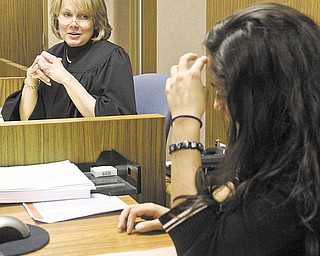Judge Theresa Dellick of Mahoning County Juvenile Court presides over a teen court session with Grimilda Ocasio-Santiago serving as a student bailiff.