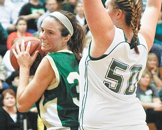Ursuline's Chase Connors (33) gets blocked by Smithville's Cortney Breeze (50)