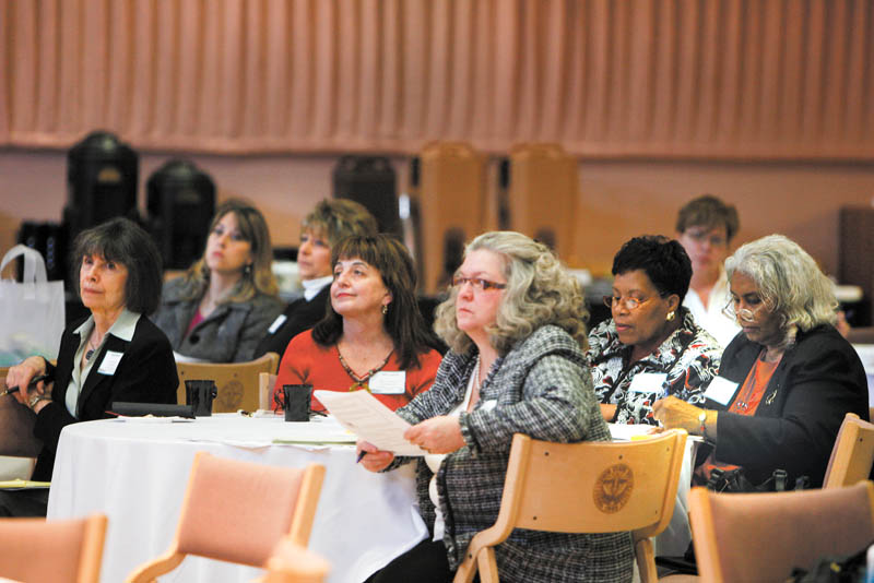 A group of women listen to Edward Hopson, senior partner of Real Estate Capital Partners, speak at Youngstown State University. He was one of the speakers Thursday at the third annual Minority & Female Business Conference.