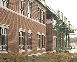 Brick work on the exterior of South Range’s new complex allows the building to begin to take on its character. The $38 million complex will accommodate more than 1,300 students.