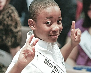 ROBERT K. YOSAY | THE VINDICATOR.. Posing for mom - LaMont Ranking Jr waits for mom to takehis picture in the 2010 -77th Vindicator Spelling Bee was held at the Chestnut Room at Kilcawley Center at YSU - 30-