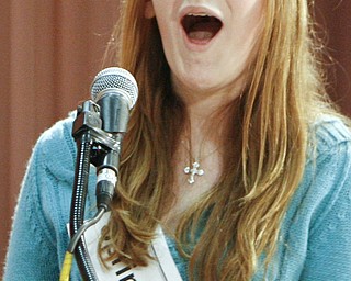 ROBERT K. YOSAY | THE VINDICATOR..Champion Julia Miglets of Springfield Intermediate School expresses shock as she realizes she won the 2010 77th Vindicator Spelling Bee in the Chestnut Room at Kilcawley Center on the Youngstown State University campus.