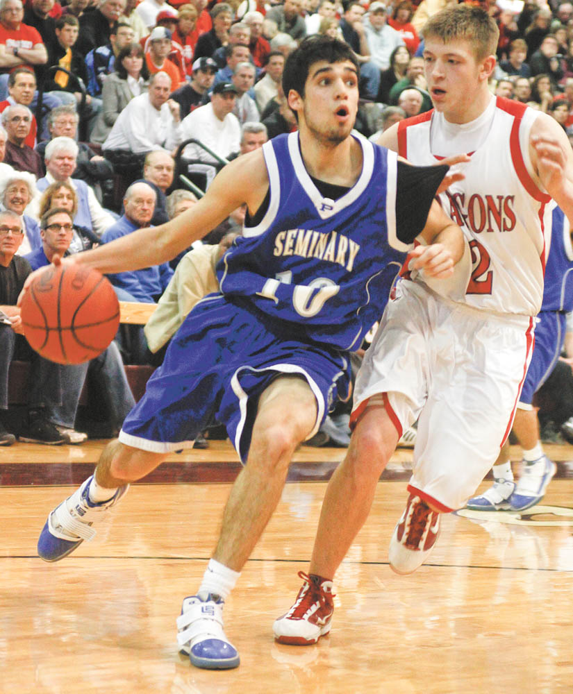 Lisa-Ann Ishihara | The Vindicator --- Poland's Nico Fatimus (10) drives the ball past Niles Dragon's Cory Floyd (2) at Boardman High School during the second period, Monday March 8, 2010