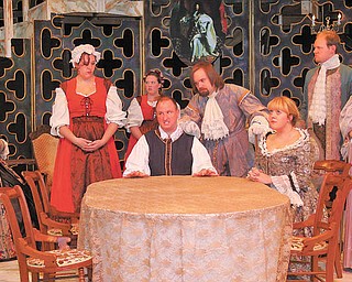 The cast of Kent Trumbull Theater's production of "Tartuffe" gathers in a scene.