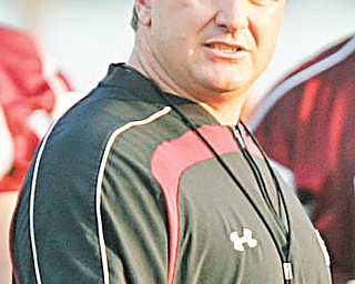 University of South Carolina offensive line coach Eric Wolford , center, talks to his players as they practice Tuesday, Aug. 4, 2009, in Columbia, S.C. South Carolina opens its season on Sept 3rd at North Carolina State.(AP Photo/Mary Ann Chastain)