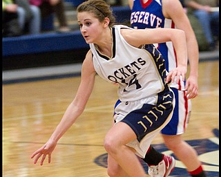 The Vindicator/Geoffrey Hauschild.Lowellville's Emily Carlson (14) drives to the basket past Western Reserve's Colleen Kennehan (10) during the fourth quarter of a game at Lowellville High School on Monday evening.