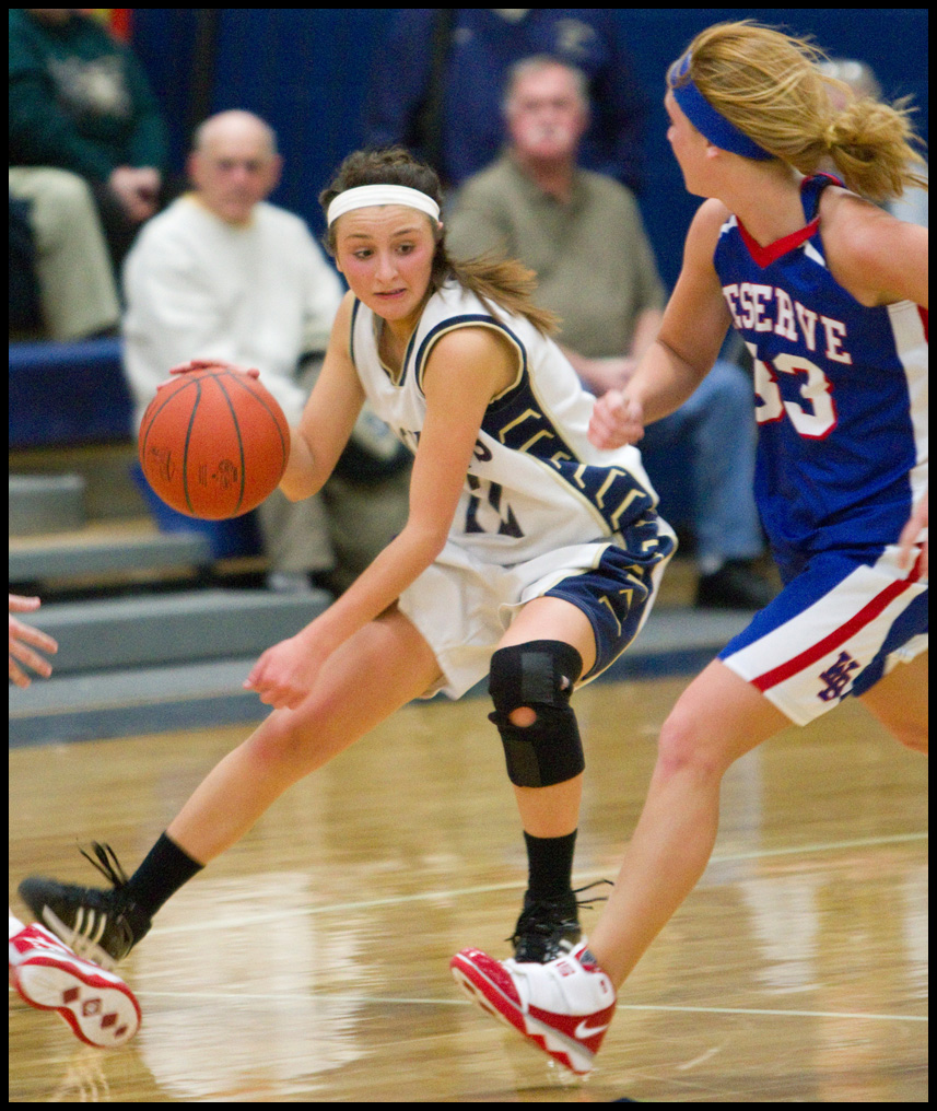 The Vindicator/Geoffrey Hauschild.Lowellville's Taylor Hvisdak (12) changes direction to avoid Western Reserve's Tori Korda (33) during the fourth quarter of a game at Lowellville High School on Monday evening.