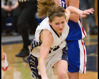 The Vindicator/Geoffrey Hauschild.Lowellville's Emily Carlson (14) takes a tumble on her way to the basket ahead of Western Reserve's Tori Korda (33) during the fourth quarter of a game at Lowellville High School on Monday evening.