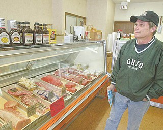 Charlie Millosin of Austintown browses the meat counter at The Meating Place on New Road, one of only a few independent butcher shops in the area. Millosin said he buys his meat from the store because it’s fresher and tastes better.