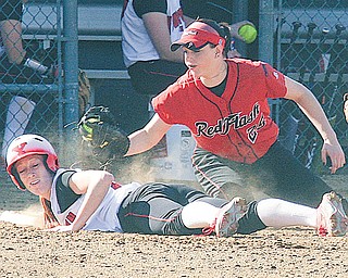 Autumn Grove of Youngstown State beats the tag by St. Francis’ Taylor Darneille (25) during the first game of a nonconference doubleheader Thursday at McCune Park in Canfi eld. The Red Flash swept the Penguins, 3-1 and 4-3.