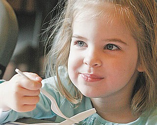 William D. Lewis| The Vindicator  Frances Gay, 4, daughter of Matt and Heidi Gay of Austintown, is all smiles as she eats pancakes at the 33 rd annual Maple Syrup Festival in Boadman Park Saturday 3-20-10.