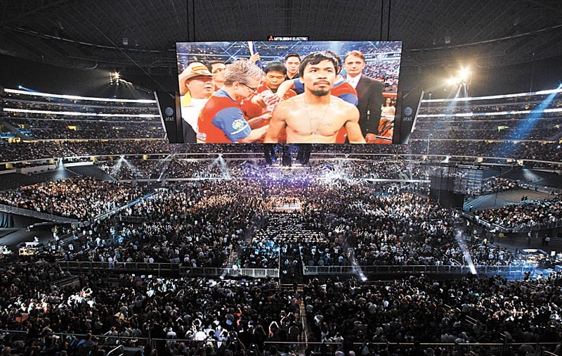 Manny Pacquiao, of the Philippines, is seen on a large video screen before his WBO boxing welterweight title fight against Joshua Clottey, from Ghana, in Cowboys Stadium in Arlington, Texas, Saturday, March 13, 2010.