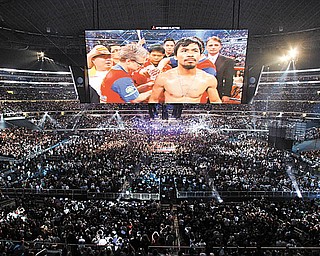 Manny Pacquiao, of the Philippines, is seen on a large video screen before his WBO boxing welterweight title fight against Joshua Clottey, from Ghana, in Cowboys Stadium in Arlington, Texas, Saturday, March 13, 2010.