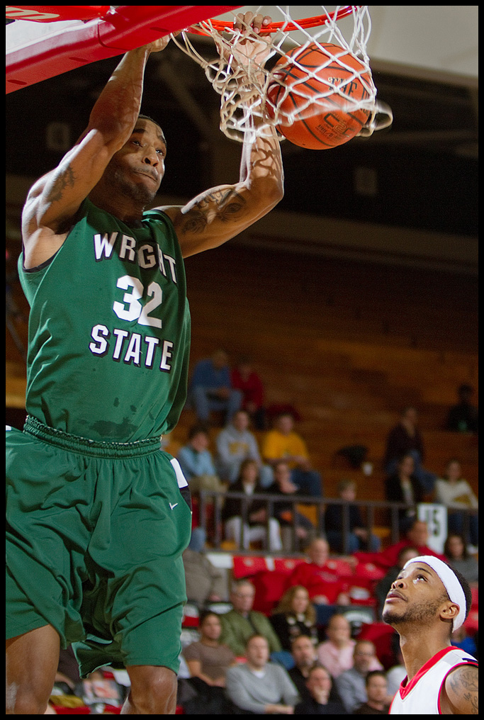 The Vindicator/Geoffrey Hauschild2.25.2010Wright State's Todd Brown (32) makes a slam dunk while Youngstown State University's Vance Cooksey looks on helplessly during the second half at YSU's Beeghley Center on Thursday evening. Wright State went on to defeat YSU 76 - 73.