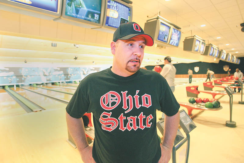 Greg Morris of Sharpsville, Pa., talks about his job search after bowling at Camelot Lanes. The Boardman alley had a jobs fair Wednesday in which job seekers received two free games of bowling.