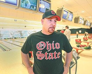 Greg Morris of Sharpsville, Pa., talks about his job search after bowling at Camelot Lanes. The Boardman alley had a jobs fair Wednesday in which job seekers received two free games of bowling.