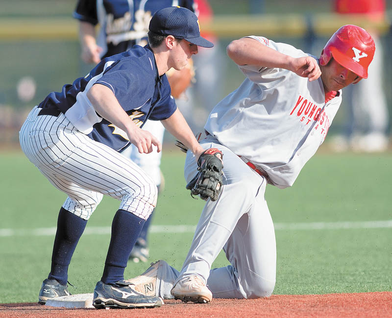YSU's Anthony Porter (24) is tagged out at second by Kent State Jimmy Rider (1) during the top of the eighth inning of a game at Kent State's Schoonover Stadium on Wednesday afternoon.
