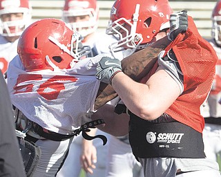 YSU Deonta Tate (56) and David Rogers (80) during practice, Wednesday March 24, 2010