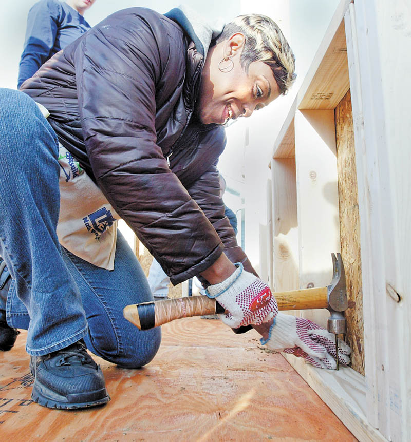Vera Ellis works on her Habitat for Humanity house. Habitat for Humanity volunteers gathered Saturday to work on a house on Maranatha Drive in Youngstown.