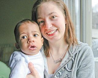 Caleb Machel is not too certain about the camera pointed his way, but his mother, Ashley Machel of Struthers, is all smiles. Caleb, nearly 8 months, appears to be fully recovered from lifesaving open-heart surgery performed when he was 6 days old.
