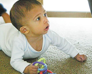Caleb is on the verge of crawling.