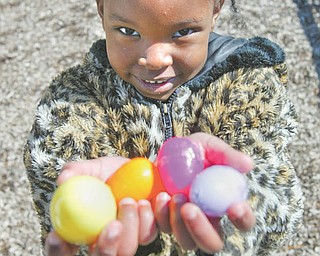 Esther Gitimu shows off the handful of Easter eggs she collected at an Easter egg hunt Tuesday sponsored by the Boardman Kiwanis for kindergarten students at Boardman schools.