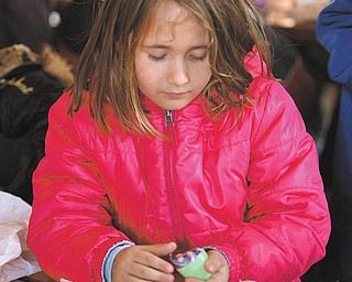 Samantha Lochrane opens one of her plastic eggs.