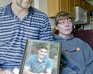 William D. Lewis | The Vindicator Michael H. Theodore Sr. and his wife Laureen Theodore react to the death of their son Michael Theodore who was killed in a automobile accident. They are shown at their Howland home.